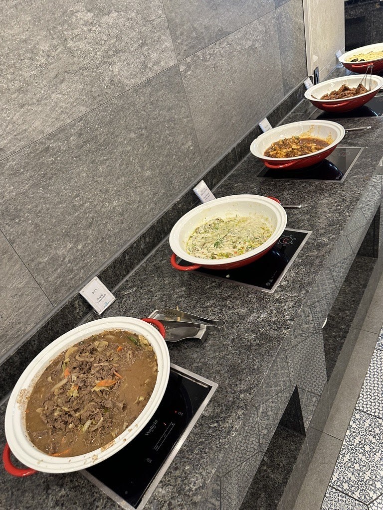 Korean hot dishes and soups in the Korean section of the Dyne Oceano Hotel breakfast buffet