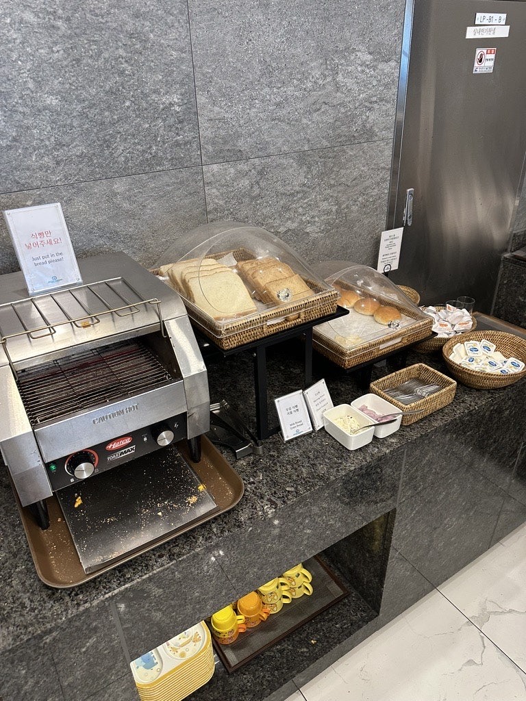 Bread, toaster and spreads at the bakery corner of the Andamiro breakfast buffet